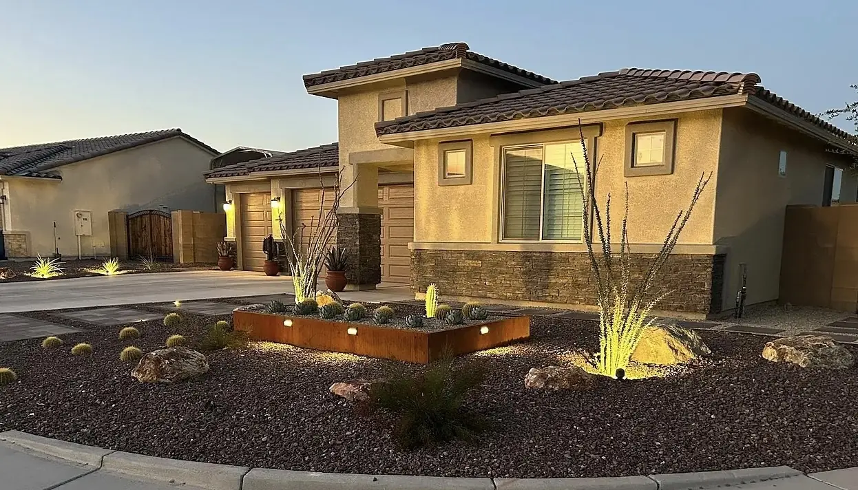 Covered patio with string lights and finished landscape at dusk
